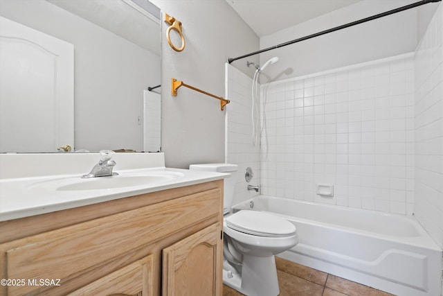 bathroom featuring toilet, tile patterned flooring, bathing tub / shower combination, and vanity