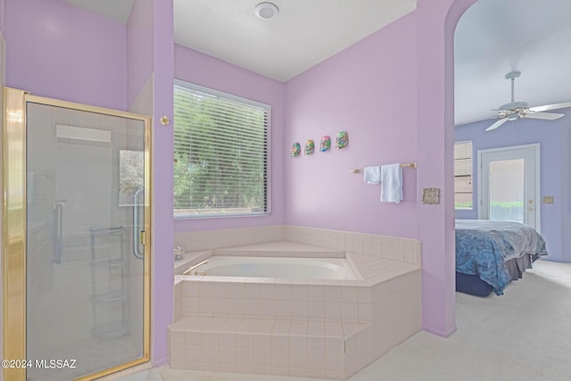 bathroom featuring ceiling fan and shower with separate bathtub