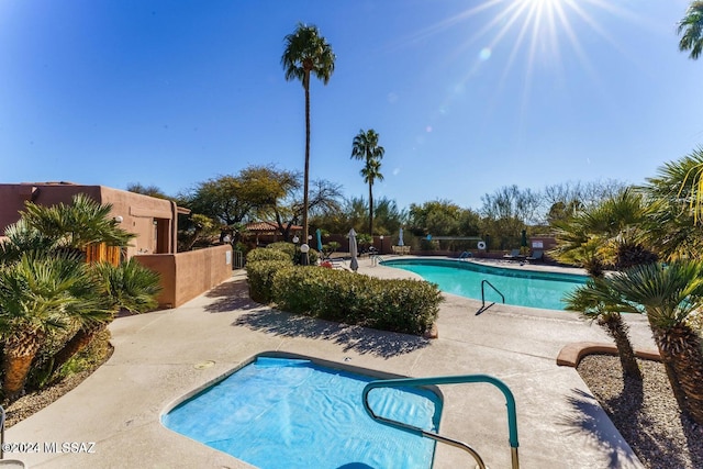 view of swimming pool with a patio area