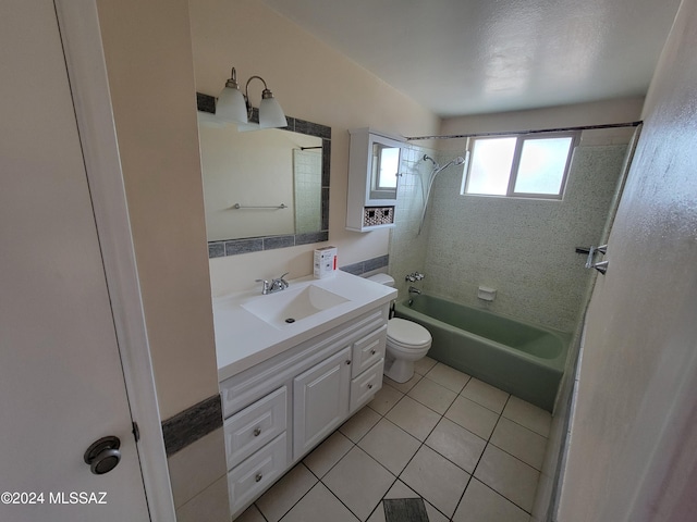 full bathroom featuring tile patterned flooring, vanity, tiled shower / bath combo, and toilet