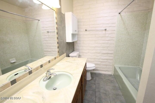 full bathroom with toilet, vanity, tile patterned floors, and tiled shower / bath