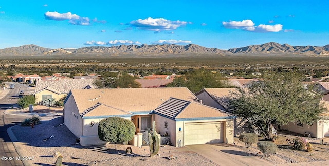 drone / aerial view featuring a mountain view