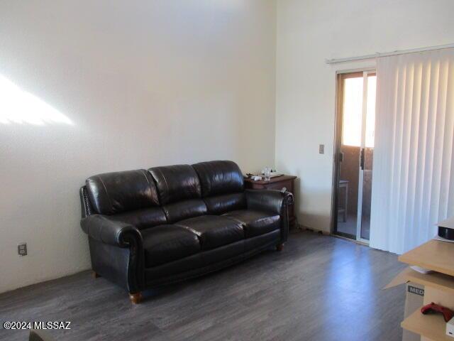 living room featuring dark wood-type flooring