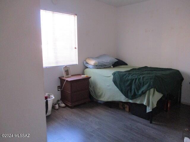 bedroom with wood-type flooring