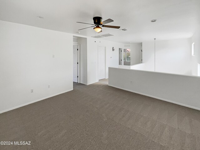 spare room with carpet and ceiling fan