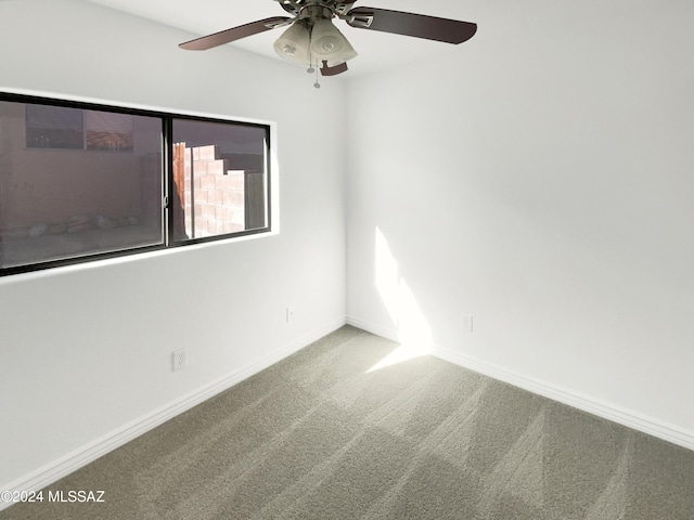 carpeted empty room with ceiling fan