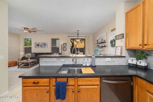 kitchen featuring tasteful backsplash, ceiling fan, sink, light tile patterned floors, and dishwasher