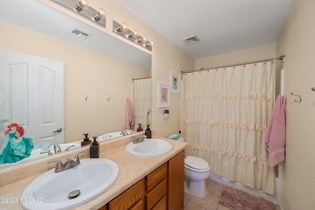 full bathroom featuring toilet, shower / bath combo, vanity, and tile patterned floors