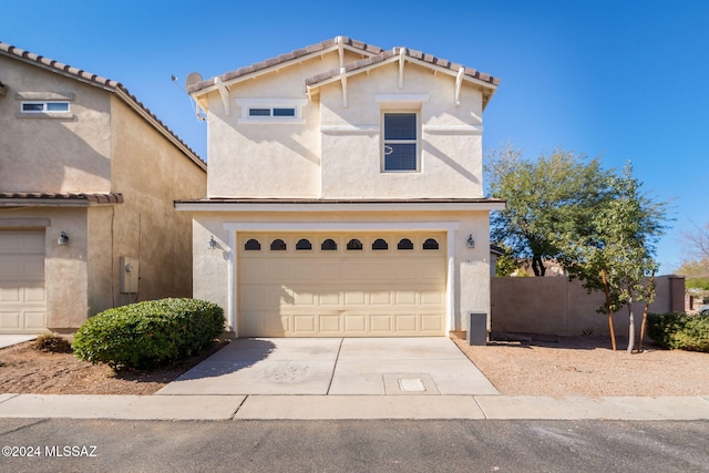 view of front of property with a garage