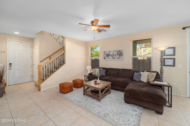 living room with light tile patterned floors and ceiling fan