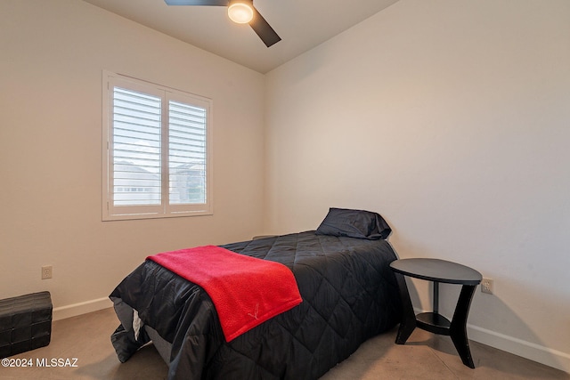 bedroom featuring ceiling fan, light carpet, and vaulted ceiling