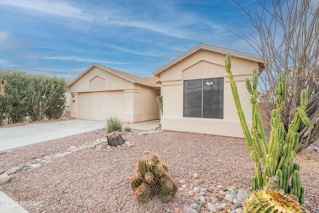 ranch-style house featuring a garage