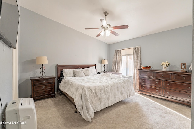 bedroom featuring ceiling fan, light colored carpet, and lofted ceiling