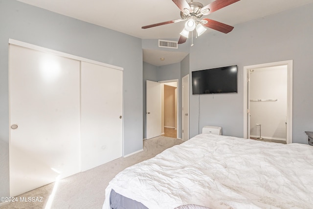 carpeted bedroom featuring ceiling fan and a closet