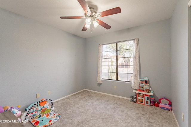 recreation room with ceiling fan and carpet floors