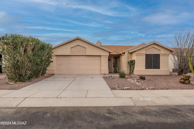 ranch-style home featuring a garage