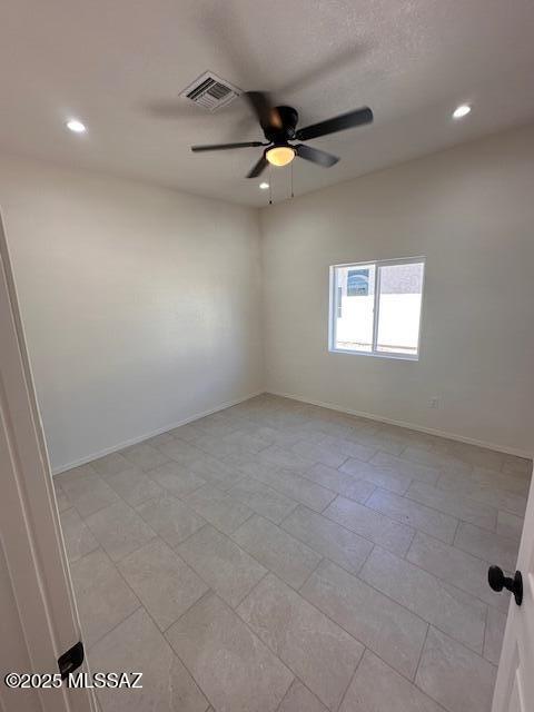 empty room featuring ceiling fan