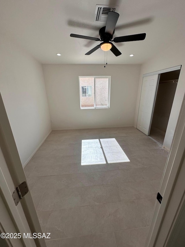 unfurnished room featuring ceiling fan