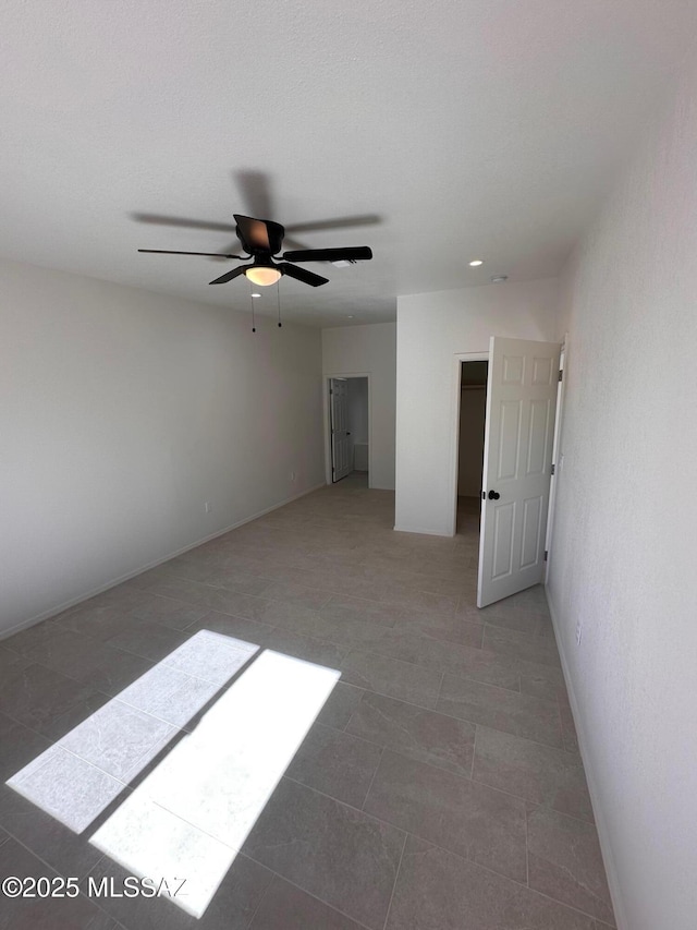 spare room with ceiling fan