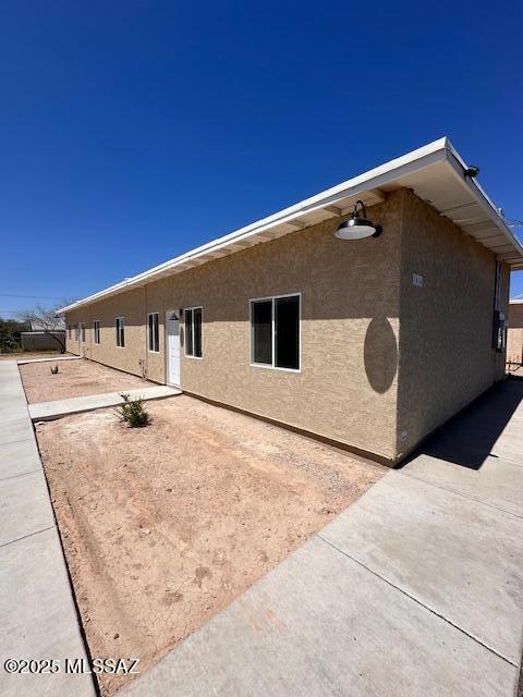 view of home's exterior featuring a patio