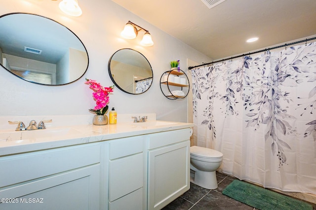 bathroom featuring tile patterned floors, a shower with curtain, vanity, and toilet