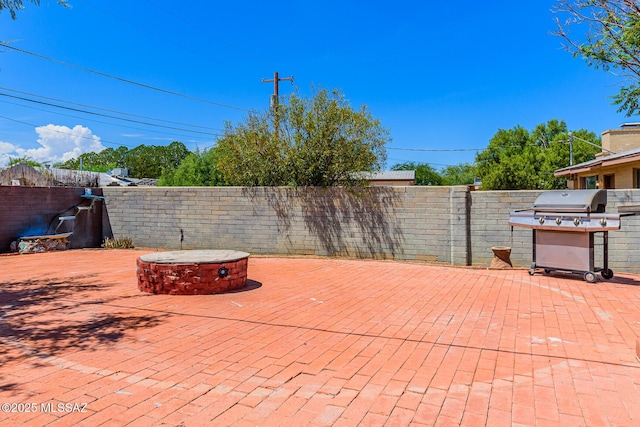 view of patio / terrace featuring a fire pit and area for grilling