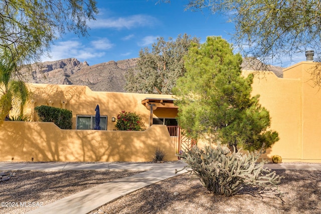 view of front of home with a mountain view