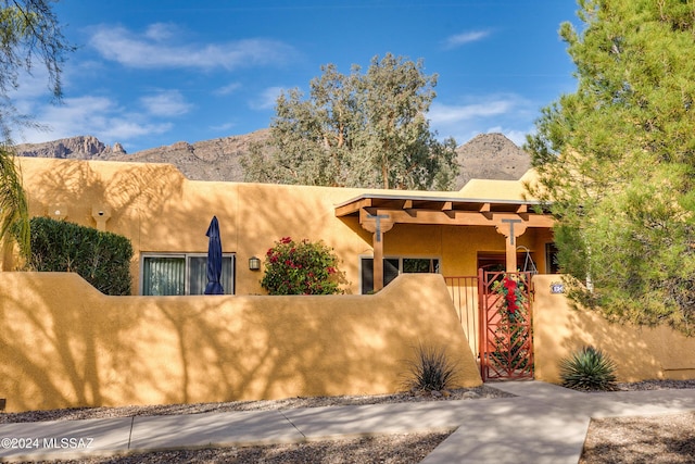 pueblo-style home with a mountain view