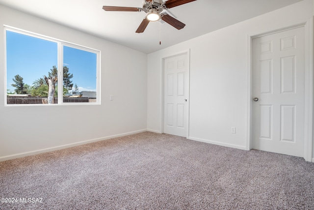 unfurnished bedroom featuring carpet flooring and ceiling fan