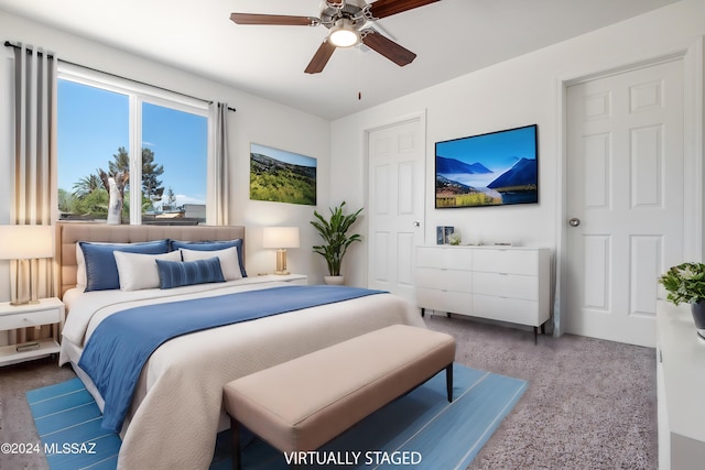 bedroom with ceiling fan and carpet floors