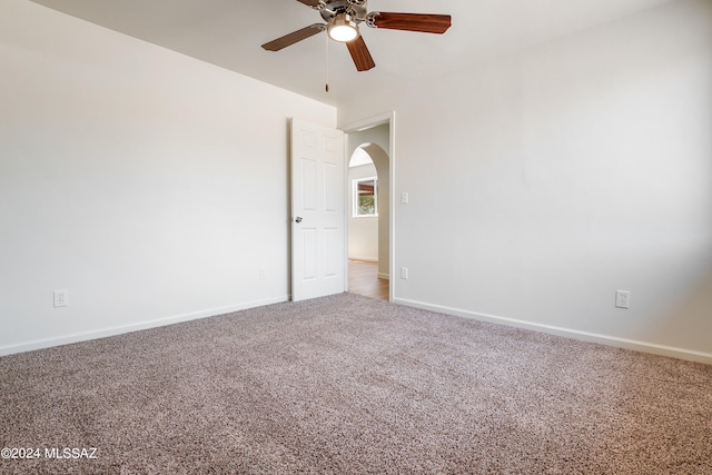 empty room with carpet flooring and ceiling fan