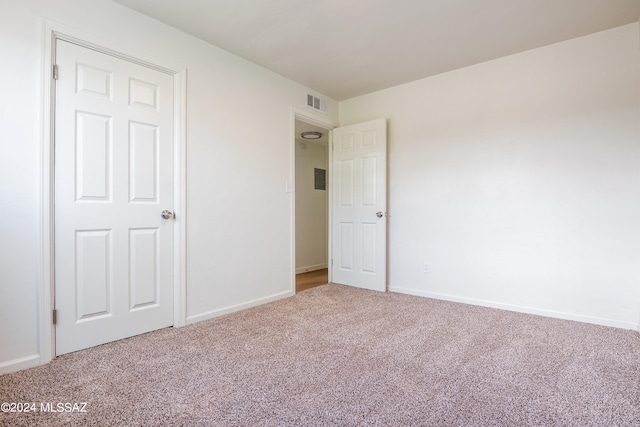 unfurnished bedroom featuring carpet flooring