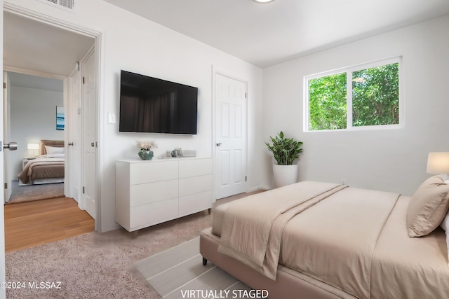 bedroom with light hardwood / wood-style flooring