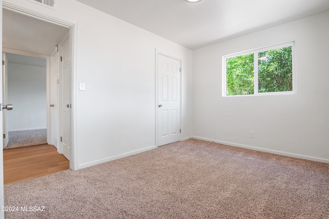 unfurnished room featuring hardwood / wood-style floors