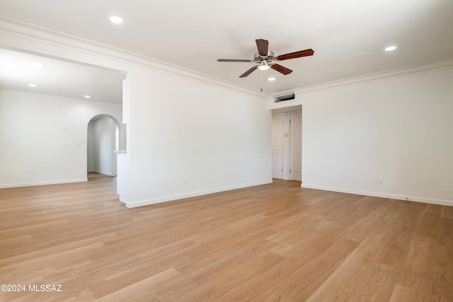 unfurnished room featuring ceiling fan, light wood-type flooring, and crown molding