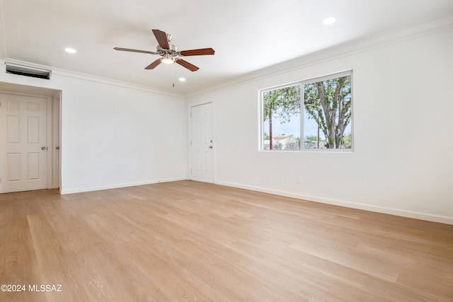 unfurnished room featuring ceiling fan, ornamental molding, and light hardwood / wood-style flooring