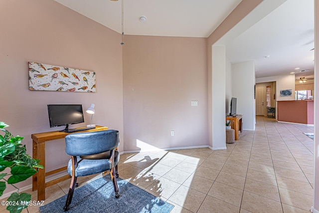 tiled office featuring ceiling fan