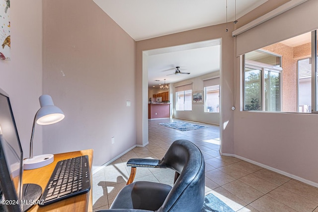 interior space with light tile patterned floors and an inviting chandelier