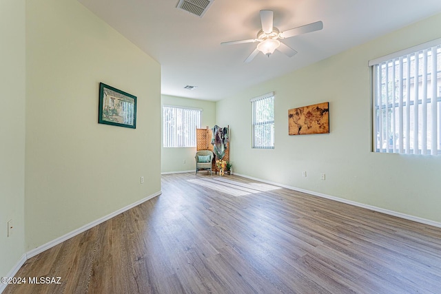 spare room featuring ceiling fan and light hardwood / wood-style flooring