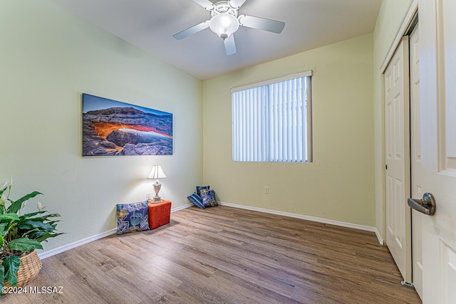 interior space with wood-type flooring, a closet, and ceiling fan