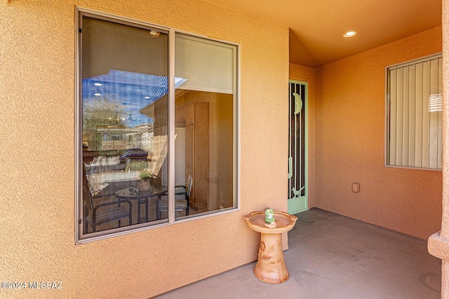 doorway to property with a patio