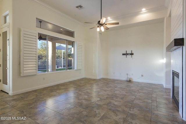 unfurnished living room with ceiling fan and crown molding