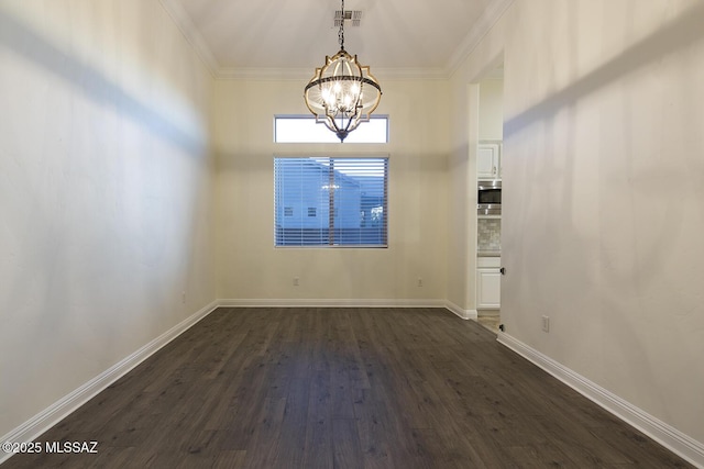 unfurnished room featuring ornamental molding, dark hardwood / wood-style floors, and an inviting chandelier