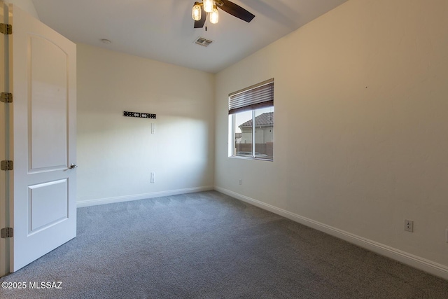 empty room featuring carpet and ceiling fan