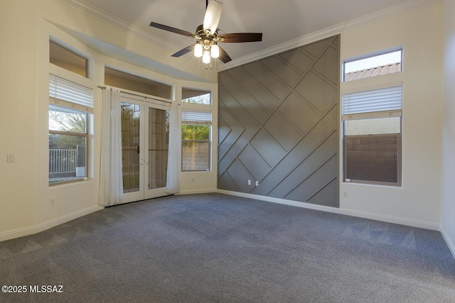 empty room with french doors, carpet floors, ceiling fan, and ornamental molding