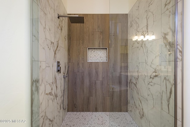 bathroom with a tile shower