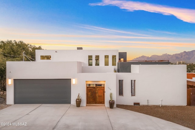 view of front of house featuring a mountain view and a garage