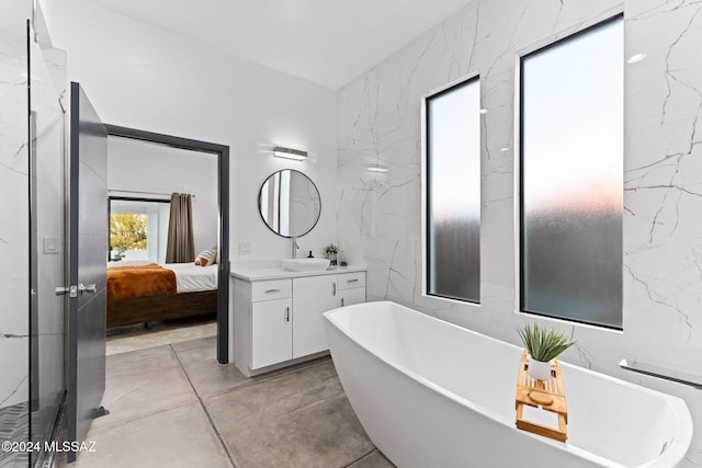 bathroom featuring a tub and vanity