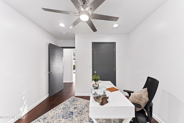 office space featuring ceiling fan and dark hardwood / wood-style flooring