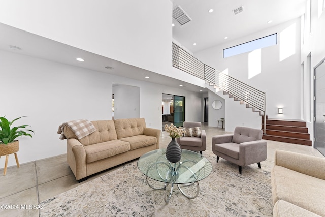 living room with a towering ceiling